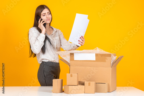 Unpacking packages. Woman u...