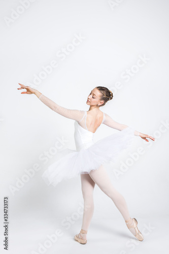 Young ballerina practising ballet moves