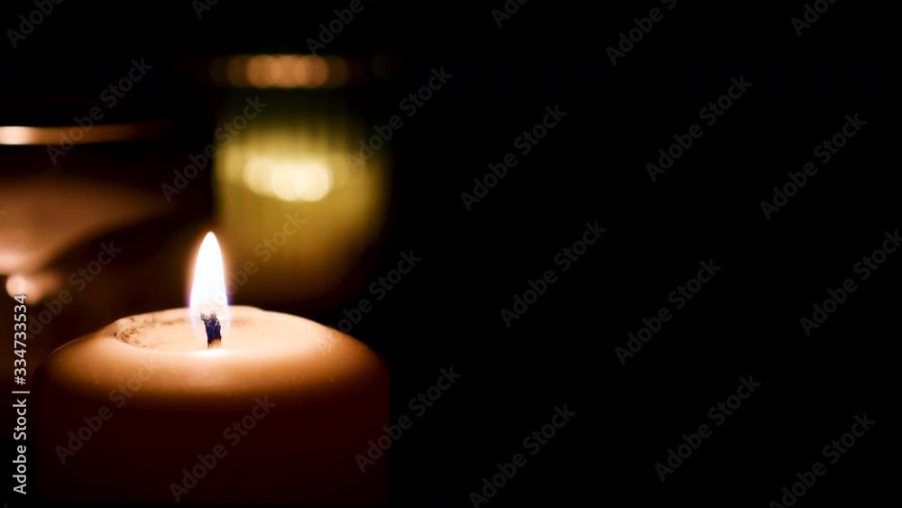Set of candles burning with dark background. Fire Wick at black environment Set of candles burning with dark background. Fire Wick at black environment