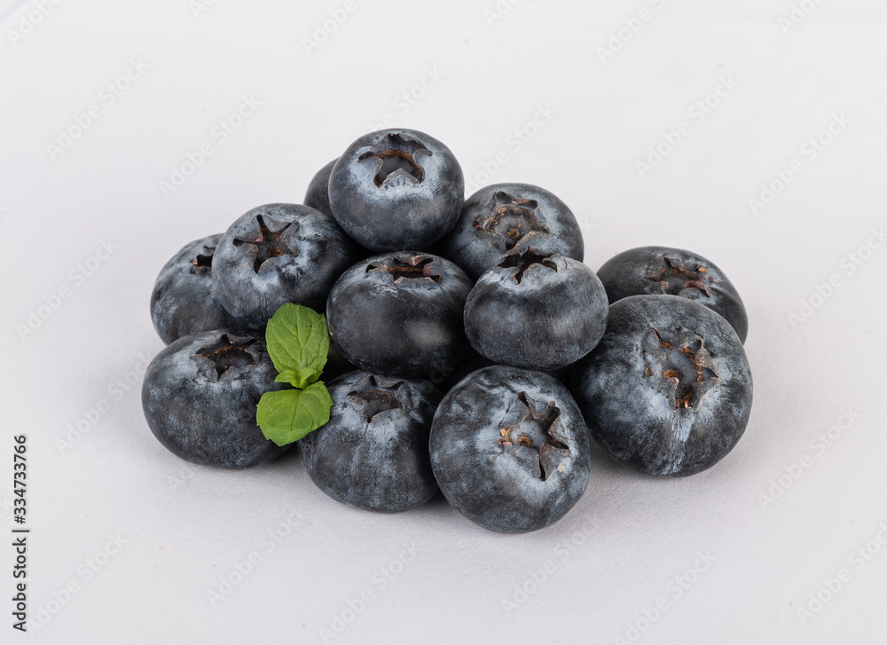blueberries with mint isolated on a white background blueberries with mint isolated on a white background