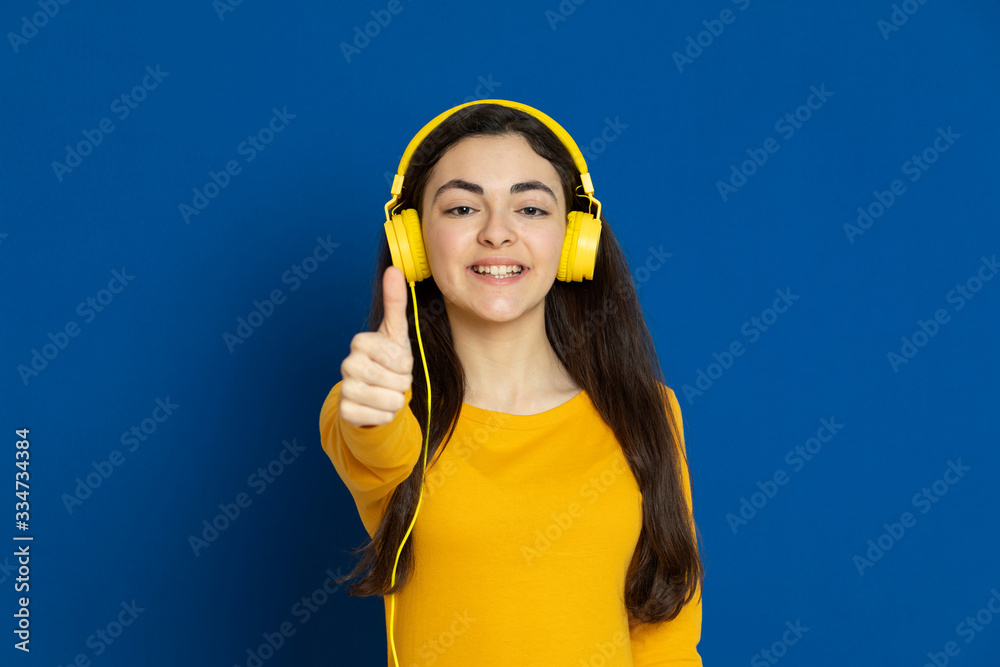 Brunette young girl wearing yellow jersey Brunette young girl wearing yellow jersey