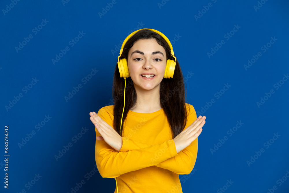 Brunette young girl wearing yellow jersey Brunette young girl wearing yellow jersey