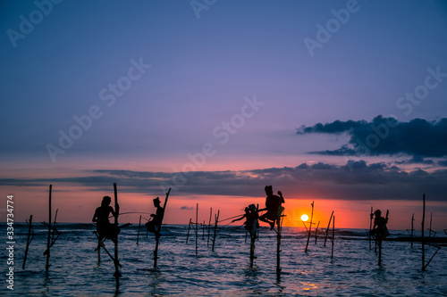 Traditional stilt fisherman at sunset in Sri Lanka