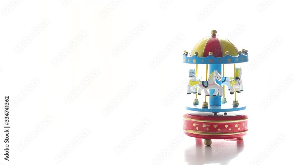 Merry-go-round toy spinning on white background Merry-go-round toy spinning on white background