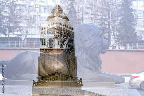 city clock tower on the background of a lion sculpture, double exposure