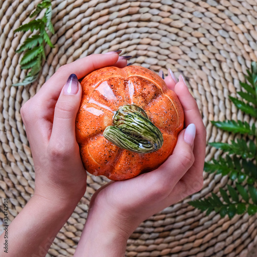 hand with pumpkin