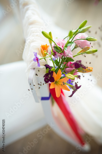 weddingflower arrangement in orange, pink and purple photo