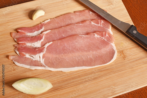 Bacon slices on a chopping board