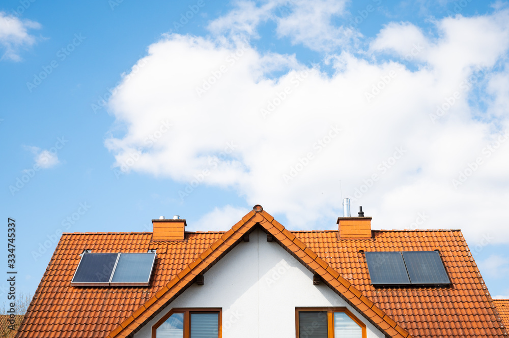 family house with solar panels and blue sky family house with solar panels and blue sky