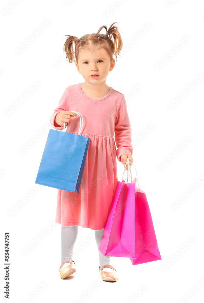 Cute little girl with shopping bags on white background Cute little girl with shopping bags on white background