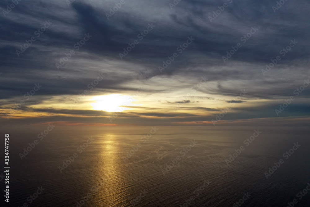 Magical sunset in Spain, stunning clouds. Shooting from the air. Seascape.