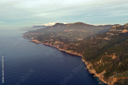 The beautiful island of Mallorca Spain, photography from the air at sunset. Seascape in the evening fog.