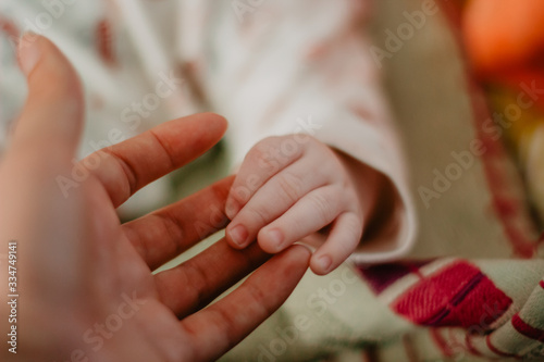 hands of a woman and baby