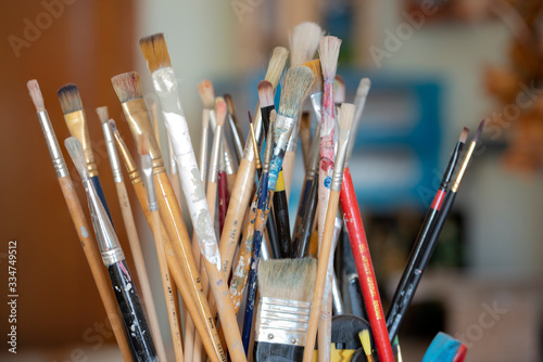 Used paint tools and brushes Ready for use in a display of color and light