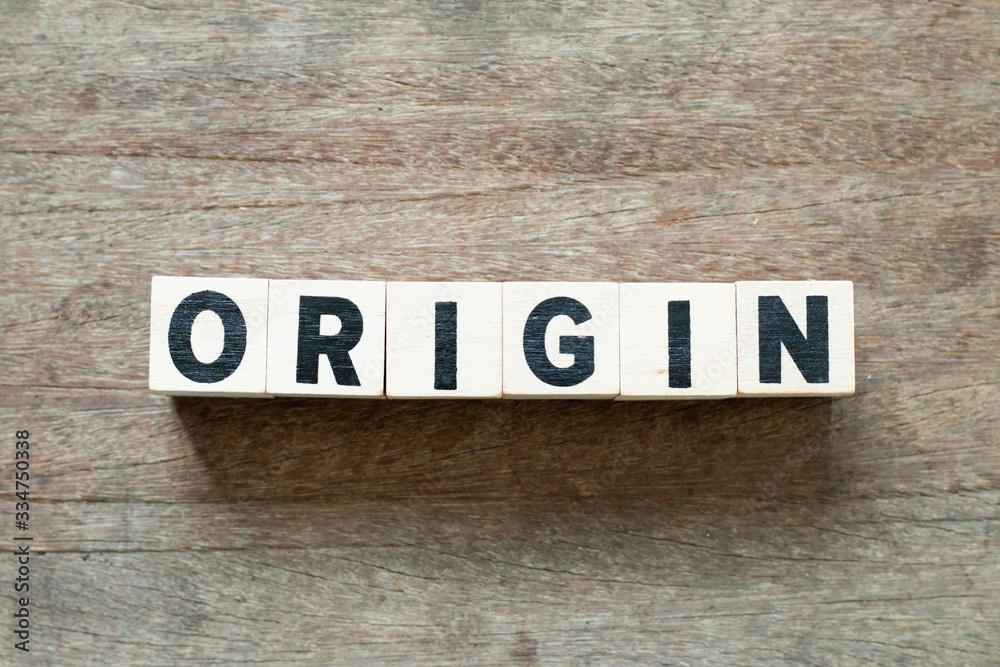 Fototapeta premium Letter block in word origin on wood background