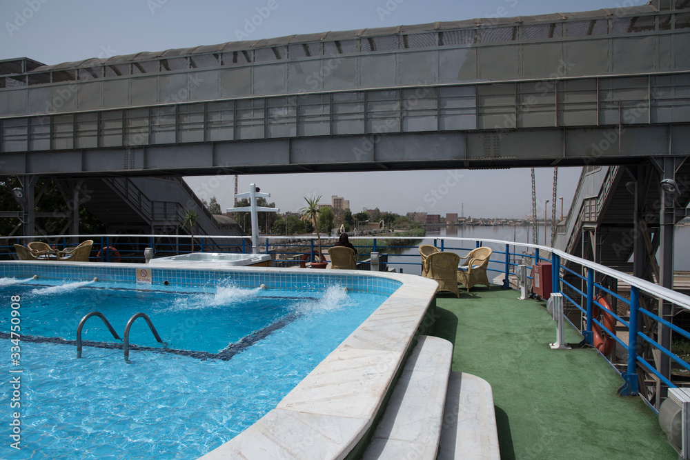Passage of a tourist cruise through the lock of the Nile River at the height of the city of Esna in Egypt, Africa. Great engineering work that saves an unevenness of 8 meters.
