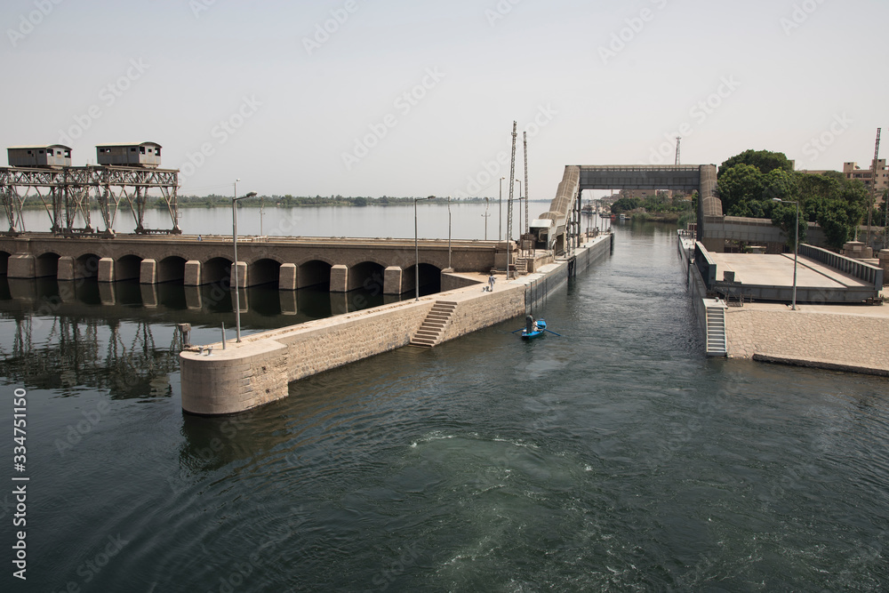 Passage of a tourist cruise through the lock of the Nile River at the height of the city of Esna in Egypt, Africa. Great engineering work that saves an unevenness of 8 meters.
