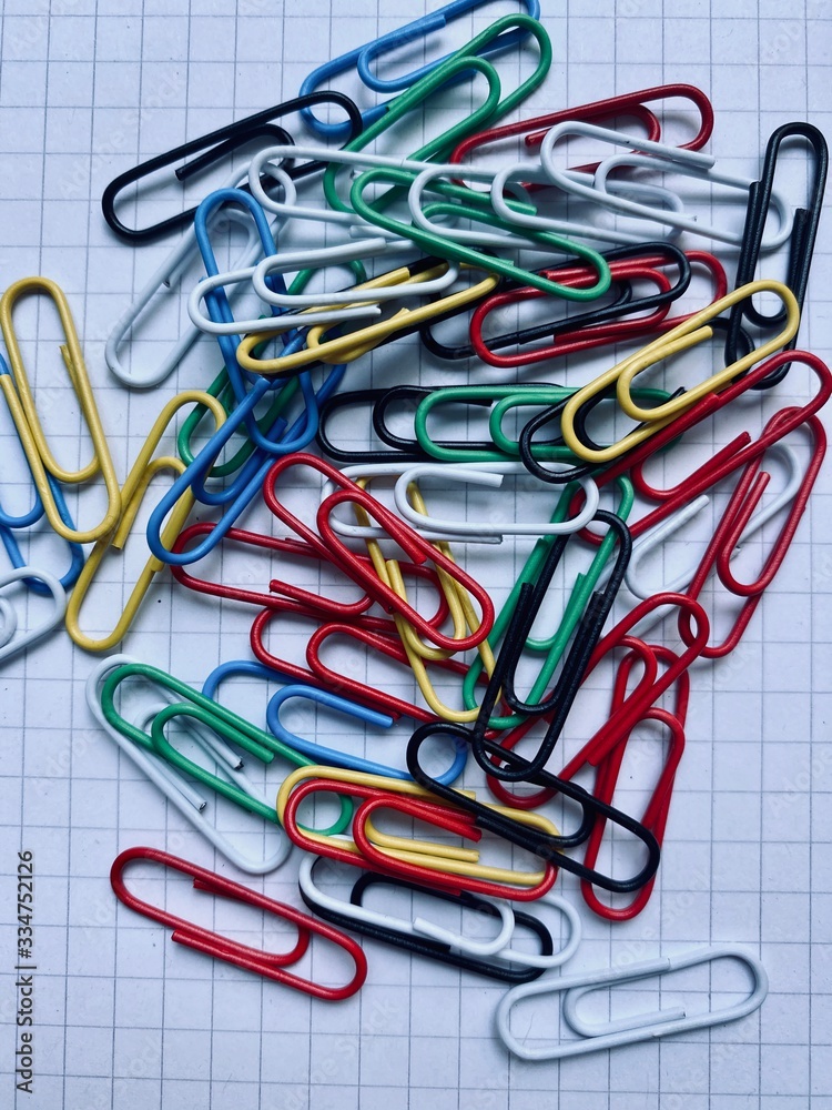 colorful paper clips on white background colorful paper clips on white background