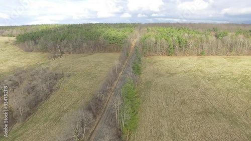 Aerial view of rural road near field