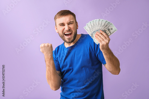Happy young man with money ...