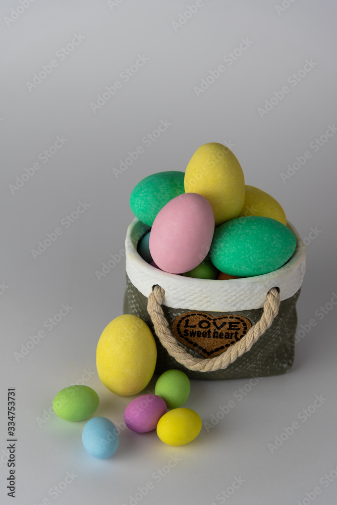 Colorful easter eggs with ceramic basket concept. Colorful easter eggs with ceramic basket concept.