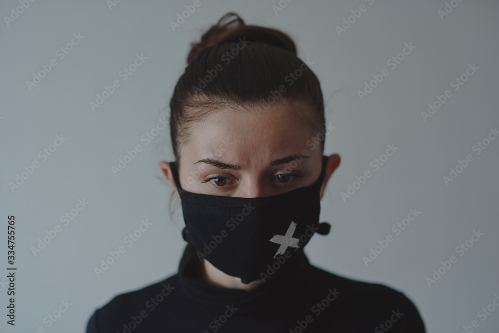 Girl in a black mask against viruses and flu Girl in a black mask against viruses and flu