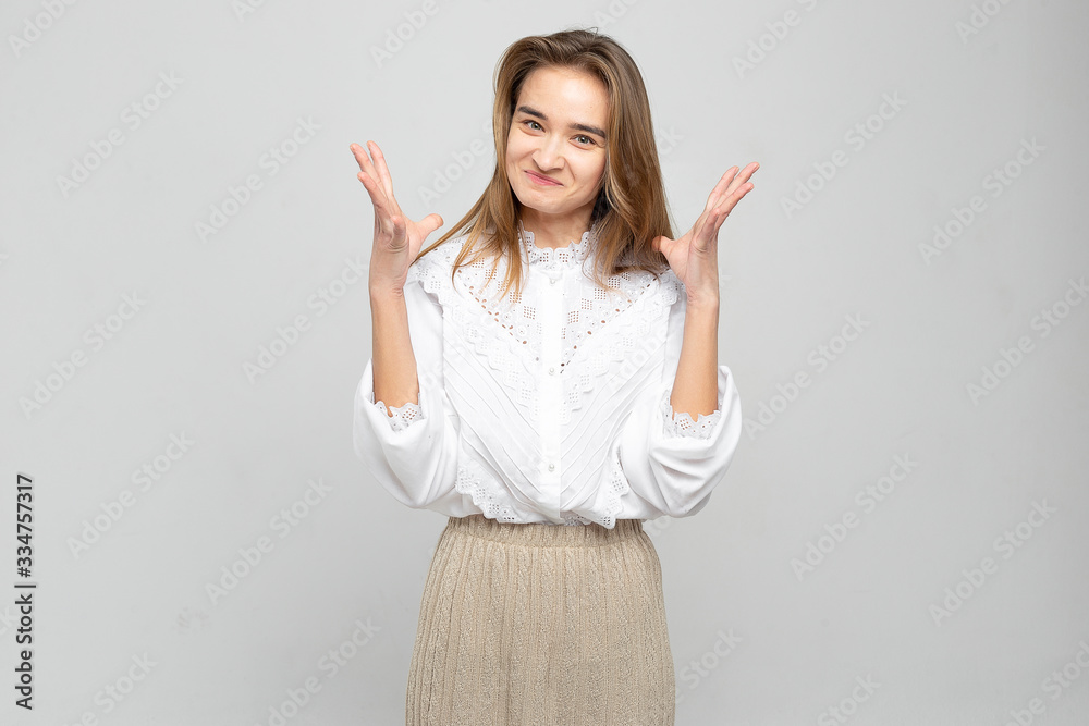 Very angry woman. Frustration. Frustrated and stressed young businesswoman. Beautiful young mixed race asian / caucasian woman isolated on white background. Very angry woman. Frustration. Frustrated and stressed young businesswoman. Beautiful young mixed race asian / caucasian woman isolated on white background.