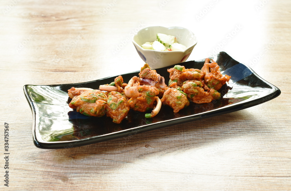 fried fish patty and squid dipping with sweet sauce fried fish patty and squid dipping with sweet sauce
