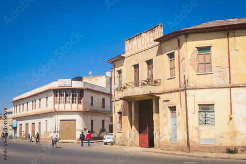 Asmara, Eritrea - November 01, 2019:  Old Buildings and Cars around of Local Market © Dave