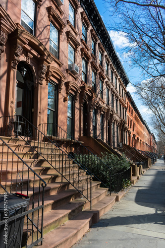 A Row of Old Colorful Brownstone Townhouses in Fort Greene Brooklyn New York photo