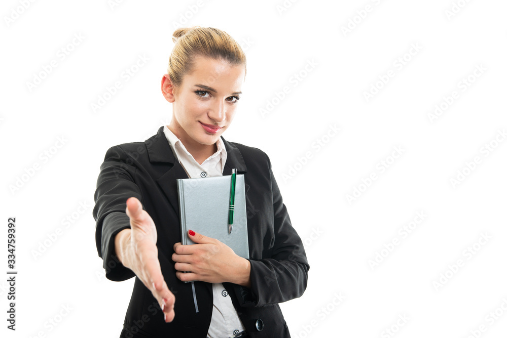 Young female assistant manager holding agenda offering hand shake Young female assistant manager holding agenda offering hand shake