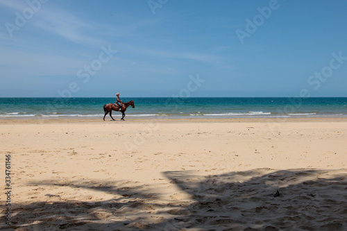 Riding a horse on the beach
