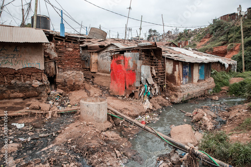 Fotografie Water Pollution in river running through slum