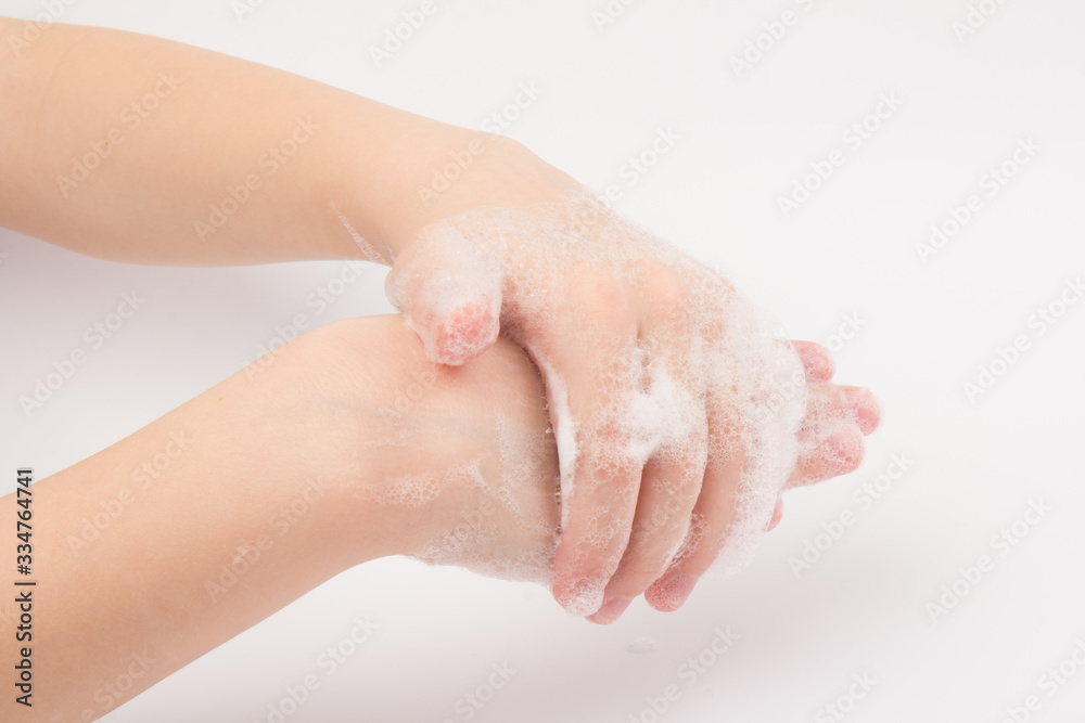 Closeup of children washing hands isolated. Cleanliness and body care concept. Global Handwashing Day Concept/Washing hands with soap