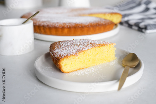 Slice of homemade sweet semolina cake on a white plate