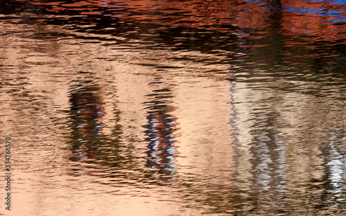 Reflection of a building on a corrugated water surface
