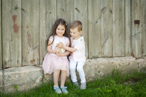 Portrait of happy kids with adorable rabbit