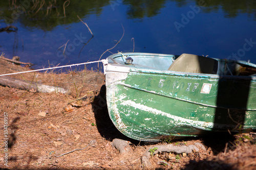 old canoe by pond