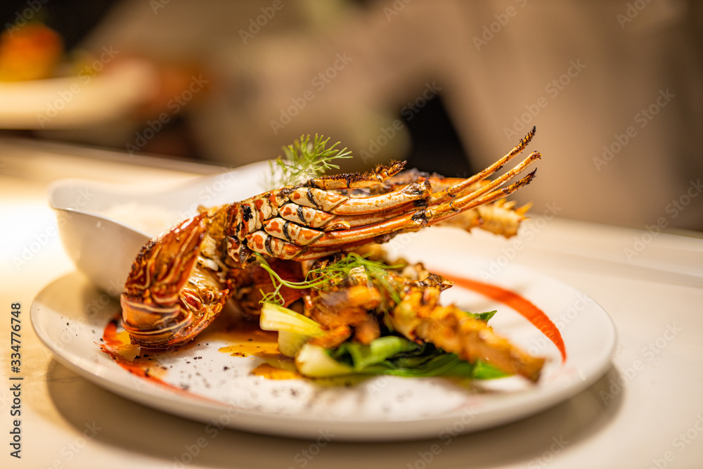 Delicious, hot and cheesy freshly baked Lobster. Juicy and tasty bright red Maine Lobster or American lobster. Sweet and flavorful lobster. Luxury seafood plate before serving, gourmet cuisine dinner
Delicious, hot and cheesy freshly baked Lobster. Juicy and tasty bright red Maine Lobster or American lobster. Sweet and flavorful lobster. Luxury seafood plate before serving, gourmet cuisine dinner