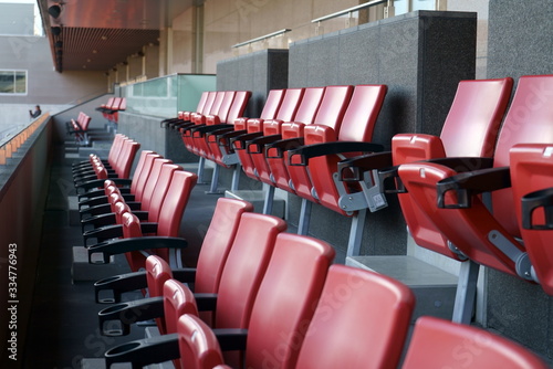 Orange spectator seats in a sports stadium