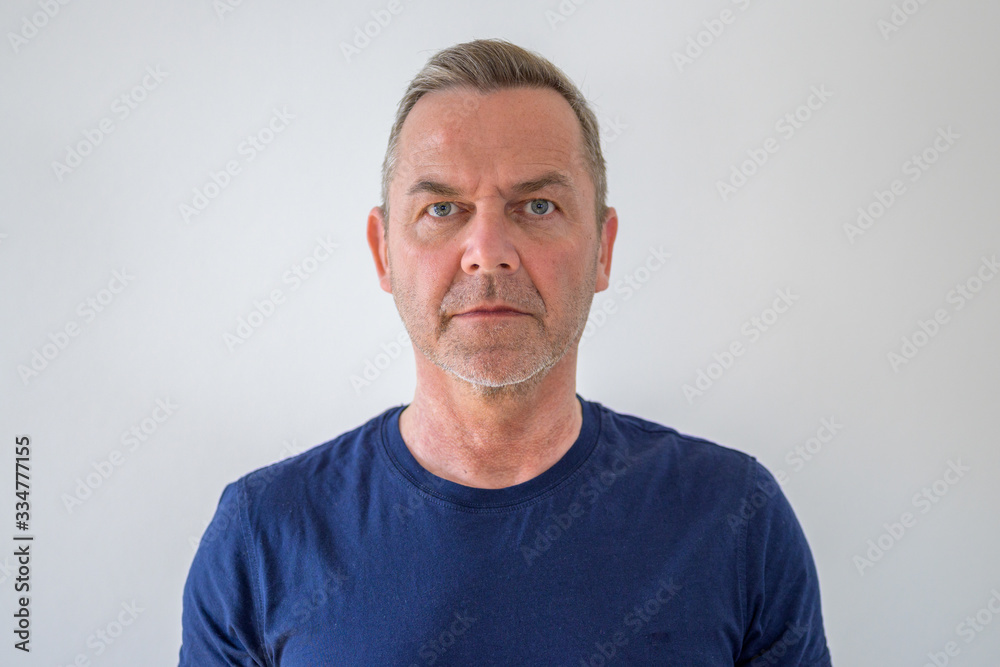 Bust portrait of middle-aged man in blue t-shirt Bust portrait of middle-aged man in blue t-shirt