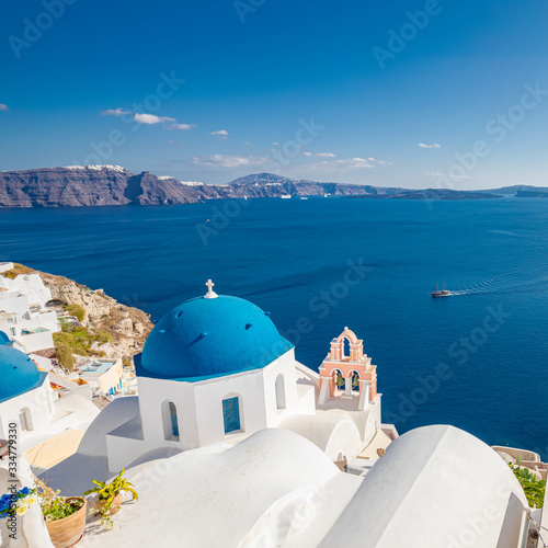Oia village, Santorini, Greece. Vacations and travel destination background. White architecture with blue dome. Peaceful and tranquil summer mood, travelling landscape