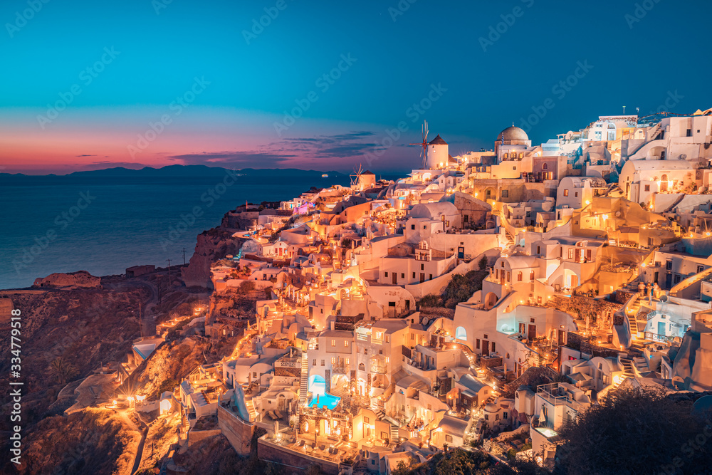 Great evening view of Oia, Santorini island. Wonderful summer sunset on the famous travel destination background. Tranquil vacation tourism