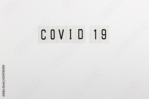 Word "Covid 19" in black on a white background with room to write.