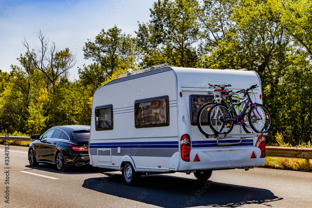 Naklejka premium Caravan trailer on a freeway road.