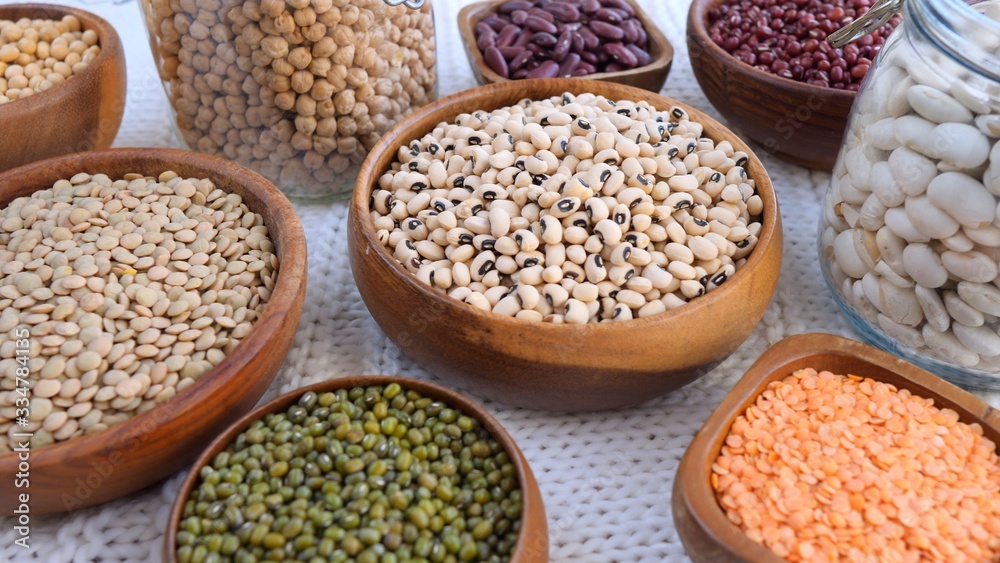 Eco Life And Healthy Food Concept. Organic Beans In Wooden Bowls And Glass Jars.
