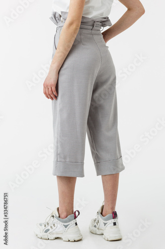 girl in grey capri shorts
