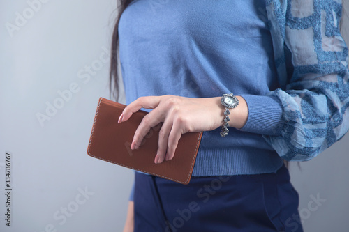 woman hand notepad with clock