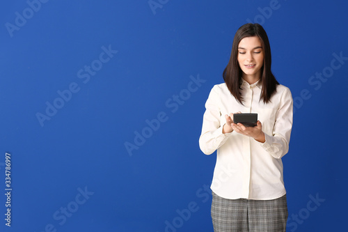 Young woman with calculator...