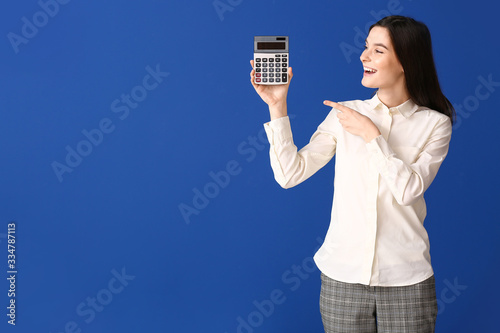 Young woman with calculator...